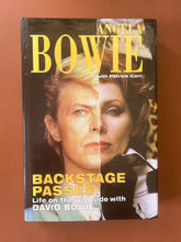 Load image into Gallery viewer, Backstage Passes by Angela Bowie: photo of the front cover which shows very minor scuff marks.