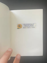 Load image into Gallery viewer, Collins Pocket Irish Dictionary by Various Authors: photo of the first page in the book which has a sticker with a previous owner's name on it.