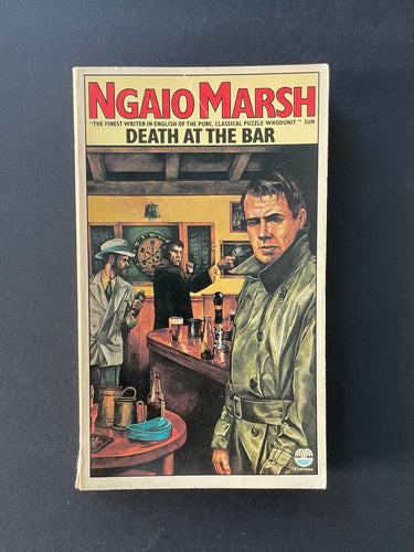 Death at the Bar by Ngaio Marsh: photo of the front cover which shows minor scuff marks and scratching, creasing at the top of the cover, and a small tear at the base of the spine.