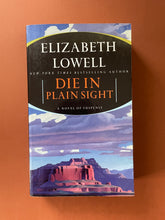 Load image into Gallery viewer, Die in Plain Sight by Elizabeth Lowell: photo of the front cover which shows creasing and scratches.