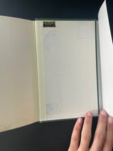 Load image into Gallery viewer, Enderby's Dark Lady or No End to Enderby by Anthony Burgess: photo of the inside of the back cover which shows small patches of the top layer that have been peeled off.