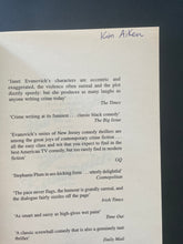 Load image into Gallery viewer, Hard Eight by Janet Evanovich: photo of the first page which shows the name of a previous owner written in blue pen at the top.