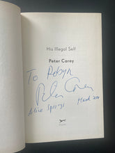 Load image into Gallery viewer, His Illegal Self by Peter Carey: photo of the title page which the author has inscribed and signed in blue pen.