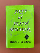 Load image into Gallery viewer, Joys of Irish Humor by Henry D. Spalding: photo of the front cover which shows very minor scuff marks along the edges of the dust jacket.