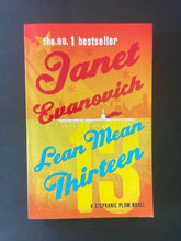 Load image into Gallery viewer, Lean Mean Thirteen by Janet Evanovich: photo of the front cover which shows very, very minor scuff marks along the edges, and minor creasing running down the left-hand side of the cover, parallel to the spine.