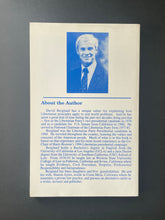 Load image into Gallery viewer, Libertarianism in One Lesson by David Bergland: photo of the back cover which shows very minor (barely visible) scuff marks along the edges.