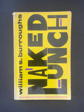 Load image into Gallery viewer, Book cover of 'Naked Lunch' by William S. Burroughs on a dark background. Photo shows creasing and scuff marks, and a tear on the top-left corner of the cover, running about 3.3 cm down, parallel to the spine.