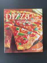 Load image into Gallery viewer, Pizza-And Other Savory Pies by Brigit Binns: photo of the front cover which shows very minor scuff marks along the edges.