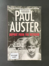Load image into Gallery viewer, Report from the Interior by Paul Auster: photo of the front cover which shows very minor scuff marks along the edges; a library barcode sticker on the top of the cover, and a library sticker on the bottom-left corner of the cover.
