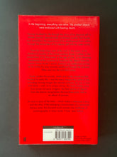 Load image into Gallery viewer, Report from the Interior by Paul Auster: photo of the back cover which shows very, very minor scuff marks along the edges.