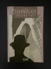 Load image into Gallery viewer, Book cover of 'The Chandler Collection Volume Two' with a silhouette of a person and cityscape. The photo shows tiny scuff marks along the edges; a very minor crease on the bottom-right corner; and a small blob of discolouring on the top-left corner.