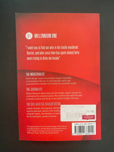 Load image into Gallery viewer, The Girl with the Dragon Tattoo by Stieg Larsson: photo of the back cover which shows very minor scuff marks along the edges.