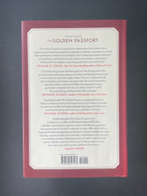 Load image into Gallery viewer, The Golden Passport by Duff McDonald: photo of the back cover which shows very minor scuff marks along the edges.
