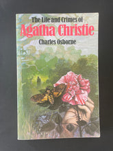 Load image into Gallery viewer, The Life and Crimes of Agatha Christie by Charles Osborne: photo of the front cover which shows minor scuff marks along the edges; a crease on the bottom-right corner; and scratching.