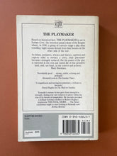 Load image into Gallery viewer, The Playmaker by Thomas Keneally: photo of the back cover which shows minor scuff marks and scratching.