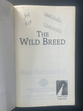 Load image into Gallery viewer, The Wild Breed by Roe Richmond: photo of the first page which shows very minor writing in black pen and two black Cancelled stamps.
