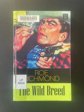 Load image into Gallery viewer, The Wild Breed by Roe Richmond: photo of the front cover which shows library stickers and minor creasing.
