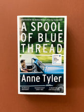 Load image into Gallery viewer, A Spool of Blue Thread by Anne Tyler: photo of the front cover which shows very minor scuff marks along the edges.