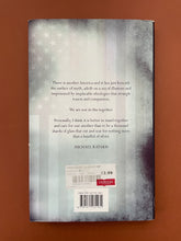 Load image into Gallery viewer, A Thousand Shards of Glass by Michael Katakis: photo of the back cover which shows minor scuff marks along the edges.