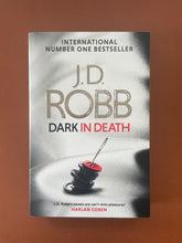 Load image into Gallery viewer, Dark in Death by J. D. Robb: photo of the front cover which shows very minor scuff marks along the edges, and minor creasing on the bottom-right corner.
