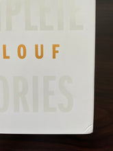 Load image into Gallery viewer, The Complete Stories by David Malouf book: scuff marks on the bottom right-hand corner of the front cover.