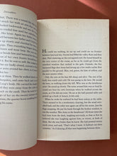 Load image into Gallery viewer, Divisadero by Michael Ondaatje: photo of pages 32/33 which show a minor rust coloured discolouring.