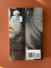 Load image into Gallery viewer, Divisadero by Michael Ondaatje: photo of the back cover which shows very minor scuff marks along the edges.