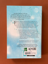 Load image into Gallery viewer, Finnikin of the Rock by Melina Marchetta: photo of the back cover which shows very minor (barely visible) scuff marks along the edges.