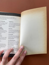 Load image into Gallery viewer, Forgetfulness by Ward Just: photo of the inside of the back cover which shows considerable yellowing due to age.