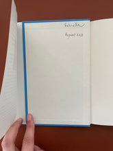 Load image into Gallery viewer, Godspeed by Casey Legler: photo of the inside of the front cover which shows the name Gabriella and the date 2018 written in black pen.