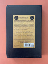 Load image into Gallery viewer, Lamb by Christopher Moore: photo of the back cover which shows minor wrinkling on the sticker.