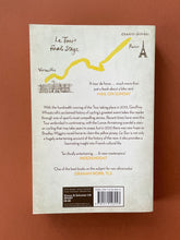 Load image into Gallery viewer, Le Tour-A History of the Tour de France by Geoffrey Wheatcroft: photo of the back cover which shows very minor (barely visible) scuff marks along the edges.