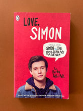 Load image into Gallery viewer, Love, Simon by Becky Albertalli: photo of the front cover which shows minor scuff marks along the edges, and some creasing on the top-left corner, under the Penguin logo.