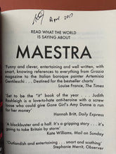 Load image into Gallery viewer, Maestra by L. S. Hilton: photo of the first page which shows, at the top, in black pen, the signature and words "April 2017".