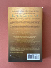 Load image into Gallery viewer, Mixed Signals by Liz Curtis Higgs: photo of the back cover which shows very minor (barely visible) scuff marks along the edges.