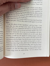Load image into Gallery viewer, Napoleon's Last Island by Tom Keneally: photo of page 89 which has a very small tear on the bottom-right corner.