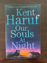 Load image into Gallery viewer, Our Souls at Night by Kent Haruf book: photo of front cover, which shows very minor scuff marks along the edges.