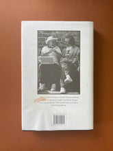 Load image into Gallery viewer, Searching for Schindler by Tom Keneally: photo of the back cover which shows scuff marks along the edges, and wrinkling on the bottom of the dust jacket.
