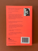 Load image into Gallery viewer, Shooting Elvis by Robert Eversz: photo of the back cover which shows very minor scuff marks along the edges.