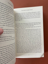 Load image into Gallery viewer, The Book of Night Women by Marlon James: photo of page 45 which shows a minor crease on the bottom-right corner of the page. Pages 45/46 are the only pages with any creasing throughout the book.