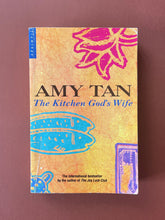 Load image into Gallery viewer, The Kitchen God's Wife by Amy Tan: photo of the front cover which shows scuff marks along the edges, and obvious creasing.