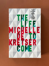 Load image into Gallery viewer, The Life to Come by Michelle de Kretser: photo of the front cover which shows creasing on the top-right corner.