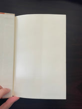 Load image into Gallery viewer, The Long Rain by Peter Gadol book: photo of a minor crease running down the middle of the first page.