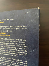 Load image into Gallery viewer, The Road to Mars by Eric Idle book: photo of very minor scuff mark on the top-right corner of the back cover.