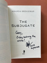 Load image into Gallery viewer, The Subjugate by Amanda Bridgeman: photo of the title page which is inscribed with the personal message: 'Gary, Enjoy solving the crime! (signature) 2019 supanova' in black texta.