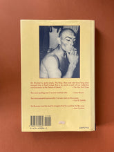Load image into Gallery viewer, Yul-The Man Who Would Be King by Rock Brynner: photo of the back cover which shows very minor scuff marks and creasing along the edges of the dust jacket, and the remainder of an old price tag, to the right of the barcode.