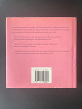 Load image into Gallery viewer, 500 Cupcakes by Fergal Connolly: photo of the back cover which shows scuff marks, mostly along the edges of the dust jacket.
