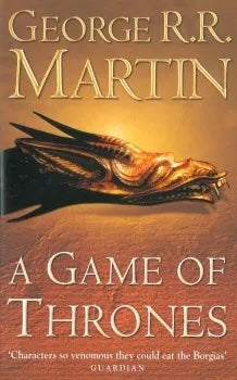 Book cover of 'A Game of Thrones' by George R.R. Martin with a gold emblem on a dark background