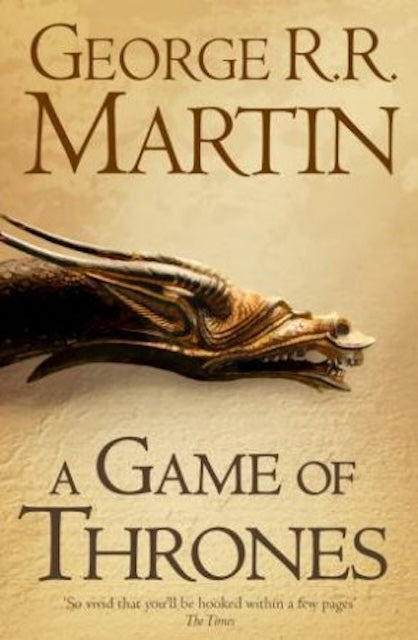 Book cover for 'A Game of Thrones' by George R. R. Martin featuring the head of a dragon over a camel coloured background.