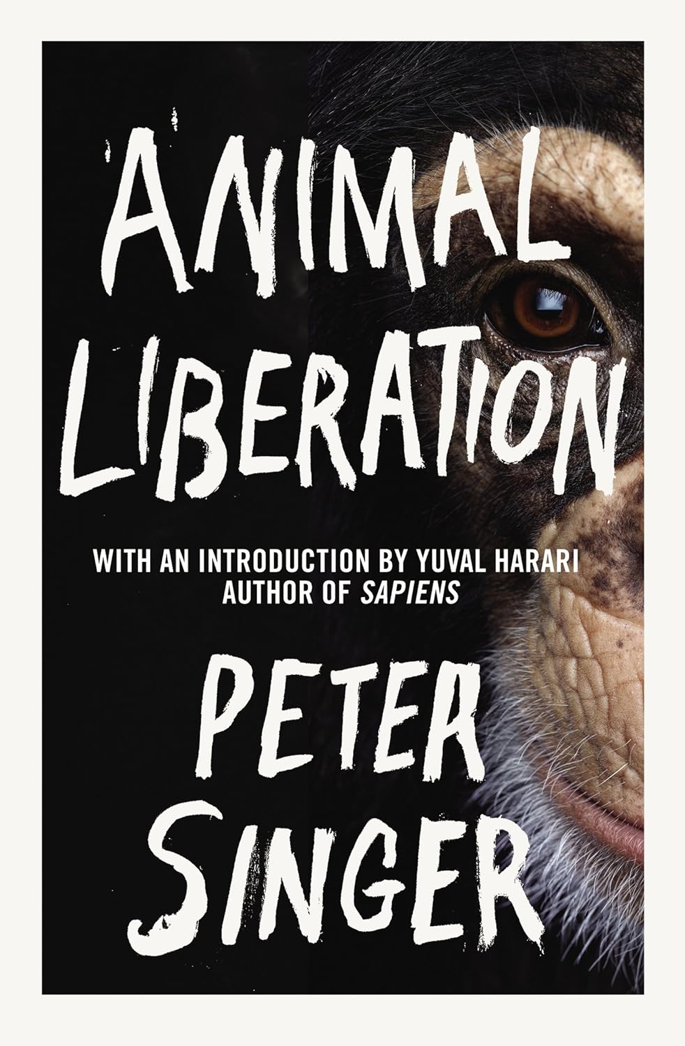 Book cover of 'Animal Liberation' by Peter Singer with a monkey's face in the background.